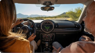 Two people talking inside a vehicle