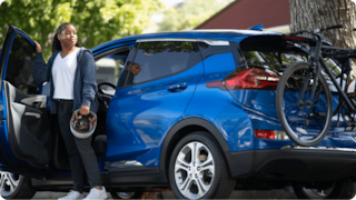 woman next to a car