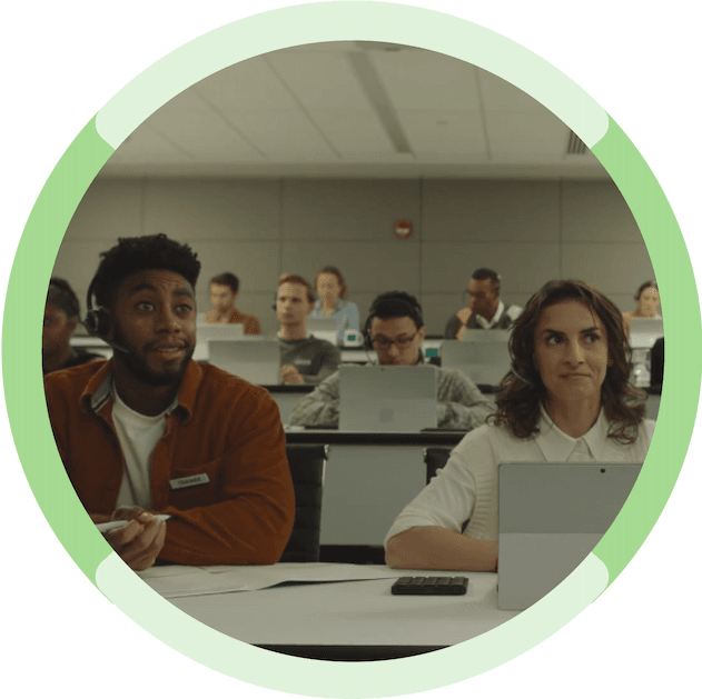 Two people sitting in class