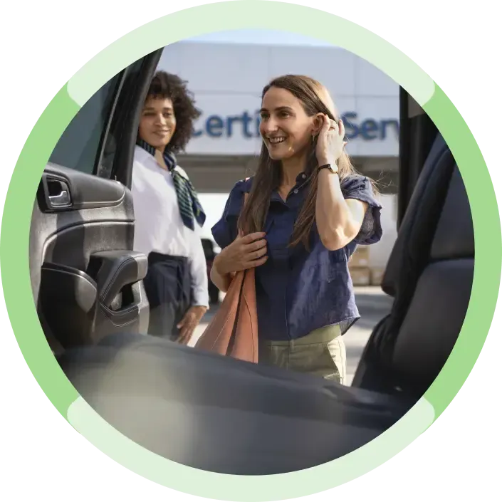 CarBravo Certified Service Team Member Showing a Customer a Used Vehicle