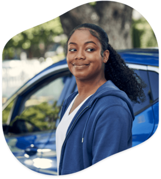 Woman peering over her left shoulder outside of the vehicle
