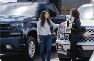 Dealer talking to woman