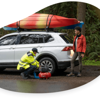 Service technician working on roadside assistance